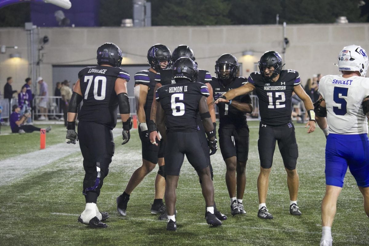 Northwestern celebrates redshirt sophomore running back Joseph Himon II's touchdown against Eastern Illinois Saturday night.