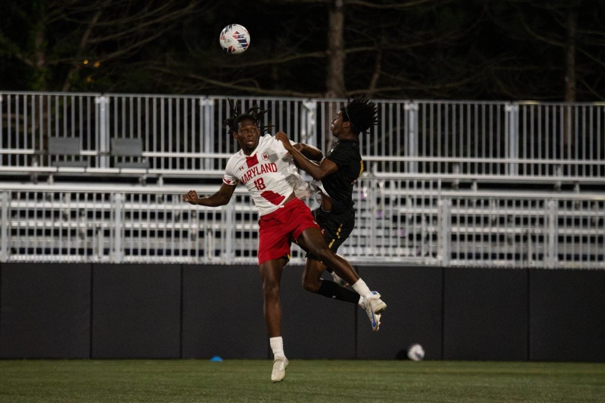 Sophomore defender Fritz Volmar and Maryland defender Jace Clark battle for a header Friday night.