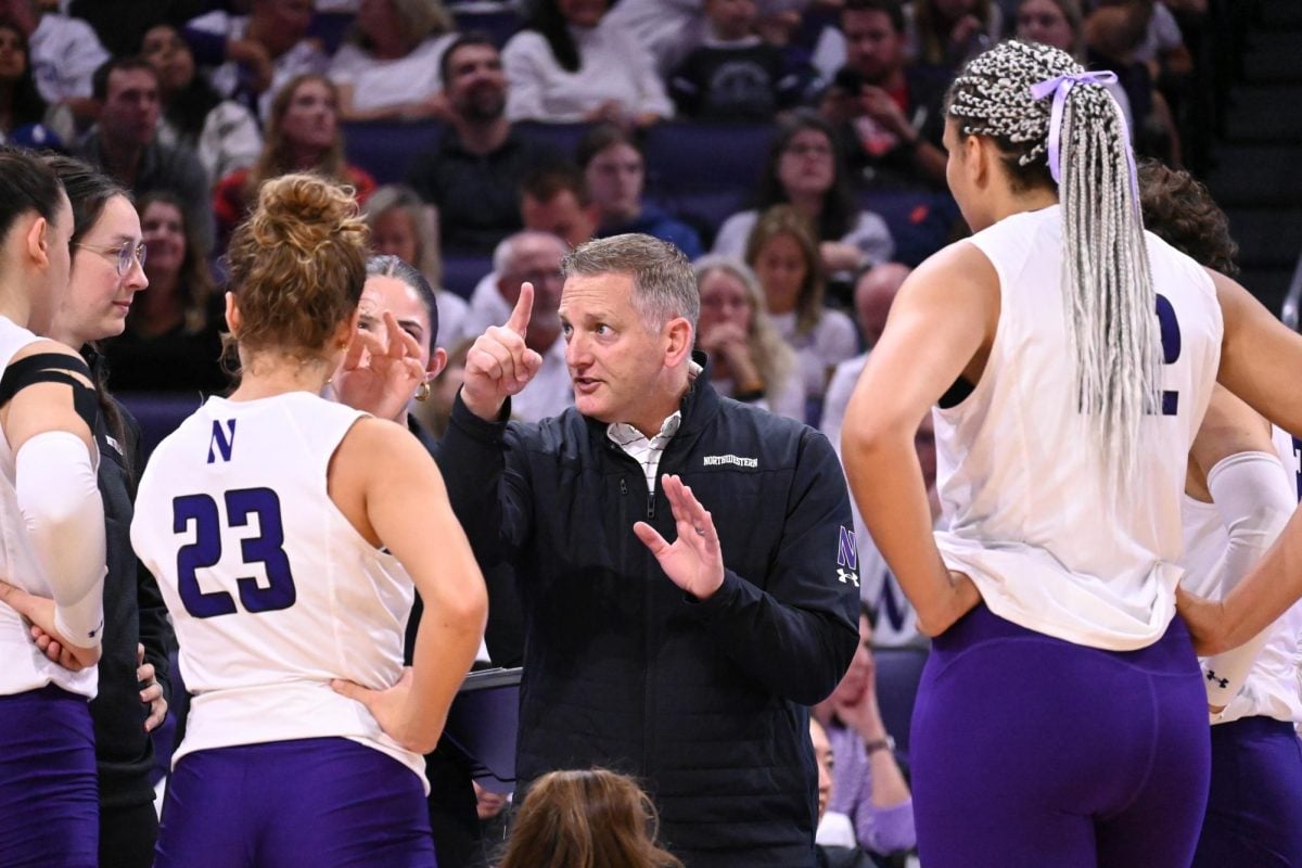 Northwestern coach Tim Nollan directs his team against Wisconsin Saturday. 