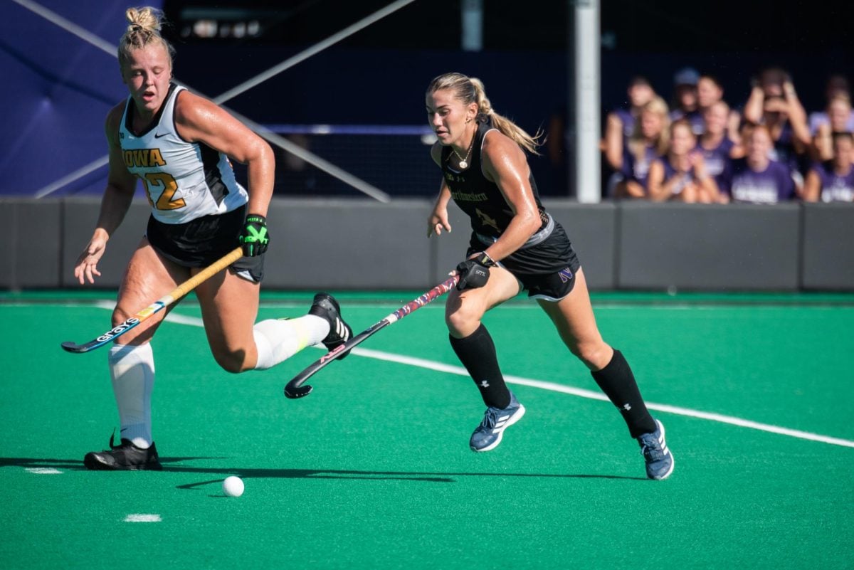 Sophomore forward Ashley Sessa dribbles toward the goal against Iowa Friday afternoon. Sessa scored two goals during Northwestern’s Big Ten opener.
