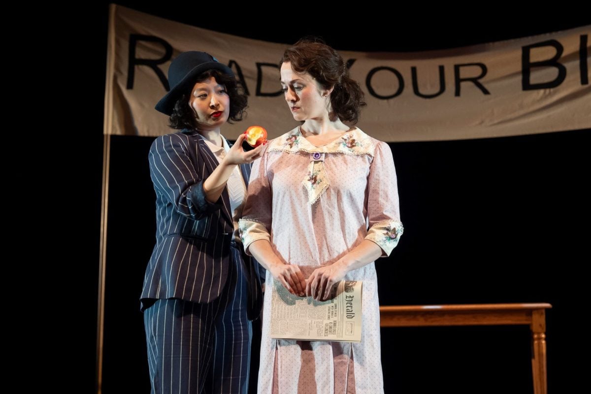  Actors Mi Kang and Tyler Meredith share a moment on stage for Goodman’s ‘Inherit the Wind’