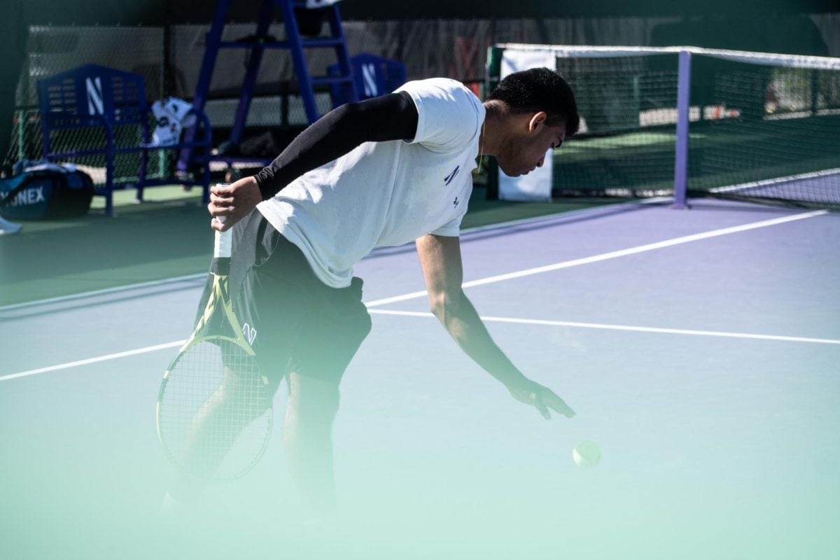 Graduate student Saiprakash Goli prepares to serve in a match last season. Goli reached the singles and doubles semifinals in the Milwaukee Tennis Classic.