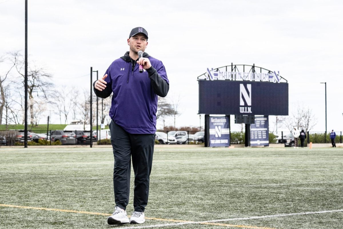 Coach David Braun addresses a spring practice crowd. Braun's Wildcats defeated Miami (Ohio) 13-6 Saturday.