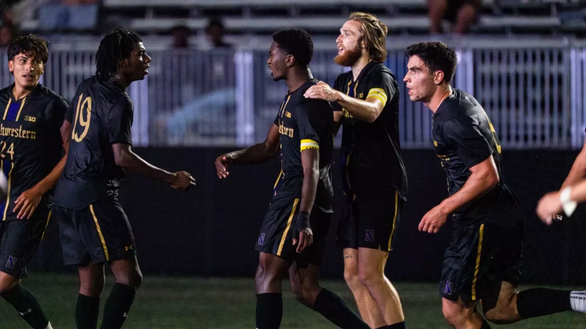 Junior center back Nigel Prince celebrates his game-winning goal against Marquette Monday night.