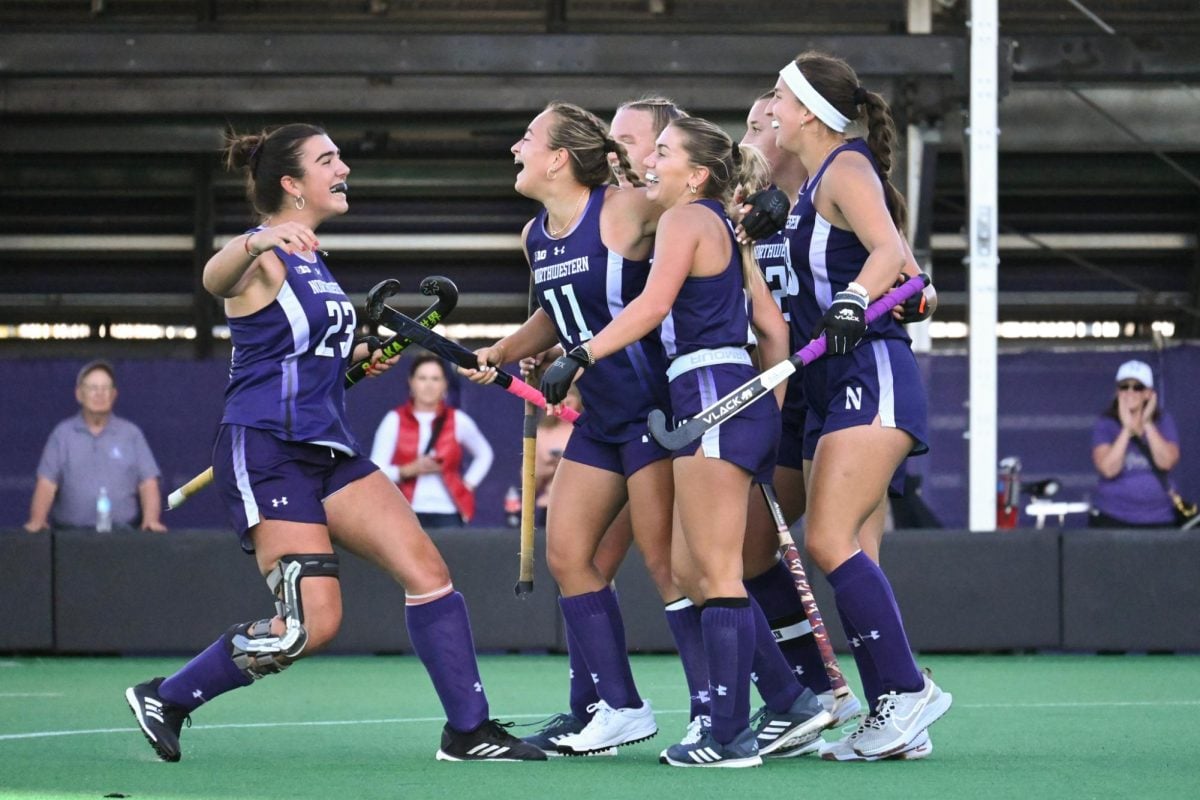 Northwestern players celebrate with their teammates following a goal. NU snagged a pair of wins this weekend, toppling Stanford 7-0 and dismantling UC Davis 11-1. 