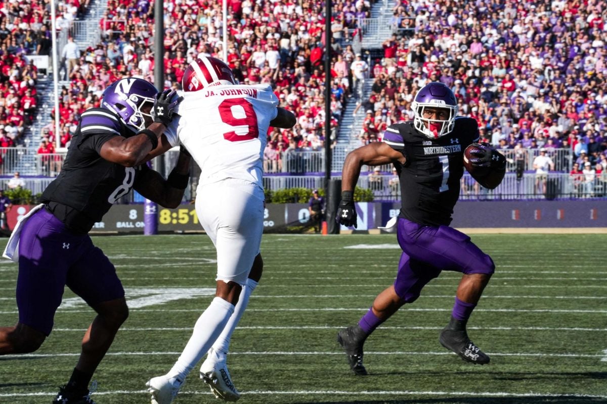 Graduate student running back Cam Porter rushes to the outside against No. 23 Indiana Saturday.