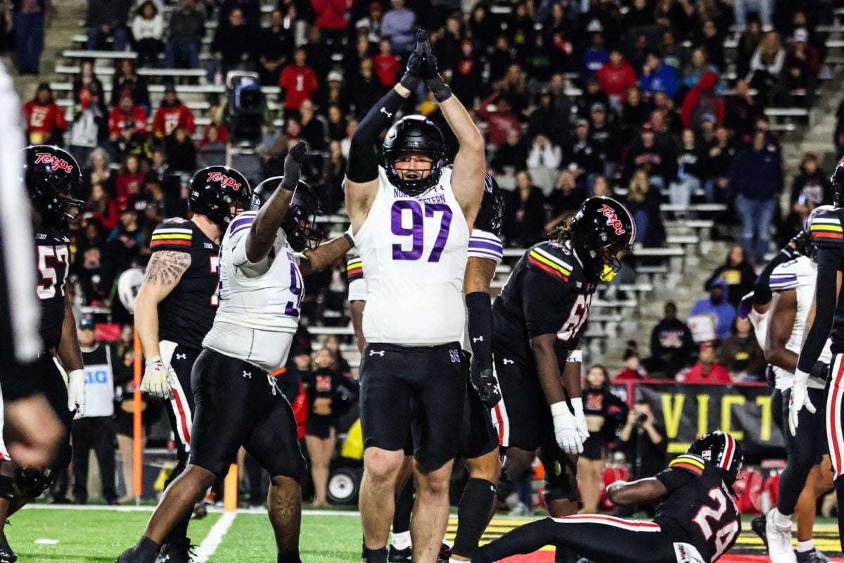 Graduate student defensive lineman Sean McLaughlin celebrates a tackle-for-loss against Maryland Friday night.