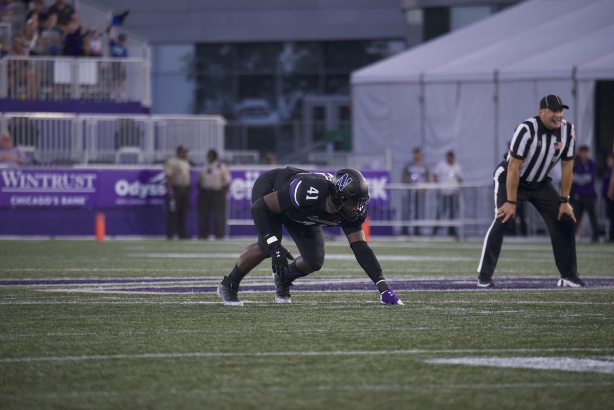 Graduate student defensive lineman Jaylen Pate lines up ahead of a snap against Eastern Illinois Sept. 14.