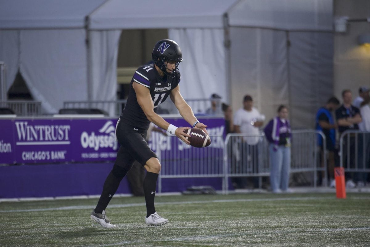 Redshirt junior punter Luke Akers gets set to punt against Eastern Illinois on Sept. 14.