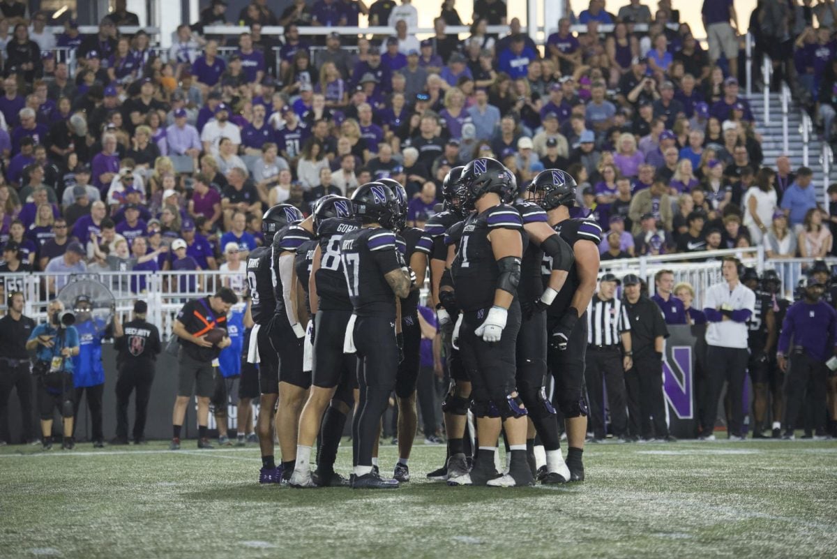 Northwestern huddles before a play against Eastern Illinois.