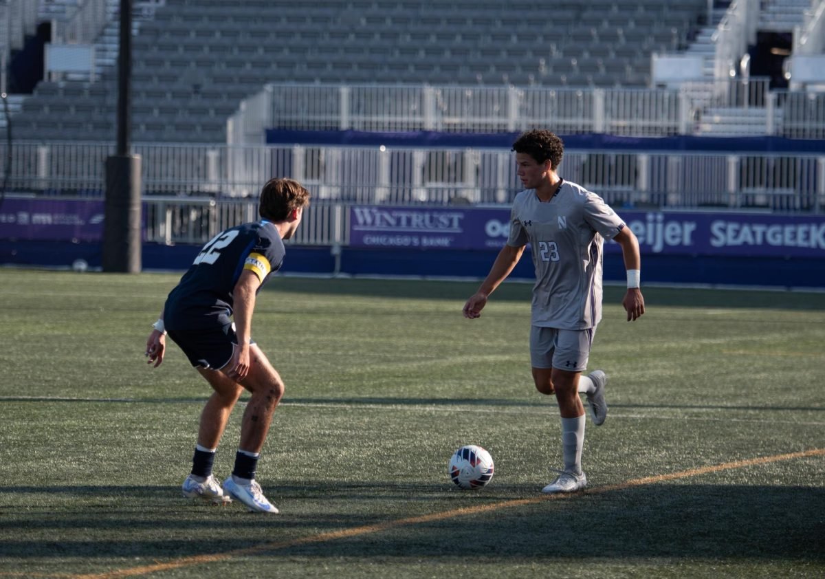 Sophomore forward Italo Addimandi looks to beat his defender down the flank. 