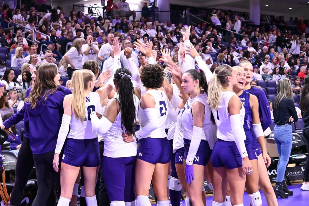 Northwestern huddles before a match earlier this season.