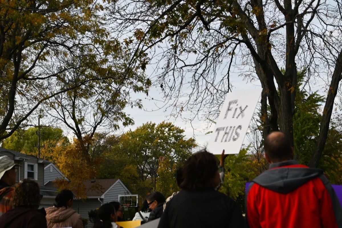 Families march during Monday's protest against possible seventh and eighth grade closures. 