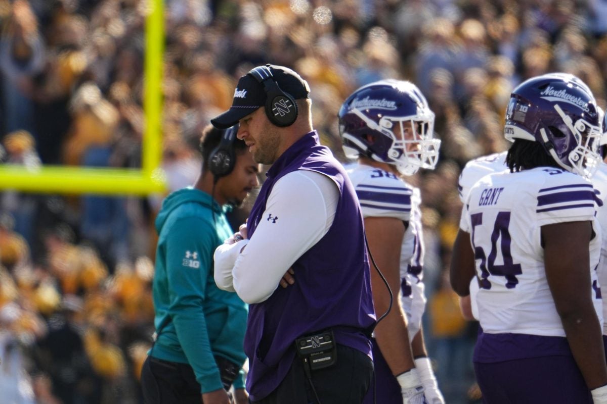 Coach David Braun stands on the sideline during Saturday’s 40-14 loss at Iowa.