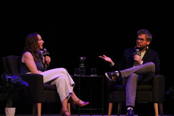 Authors John Green and Rebecca Makkai speak on stage in Cahn Auditorium during the Chicago Humanities Festival. 