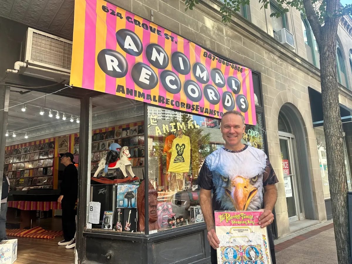 Greg Allen, owner of Animal Records, poses in front of his newly opened store.
