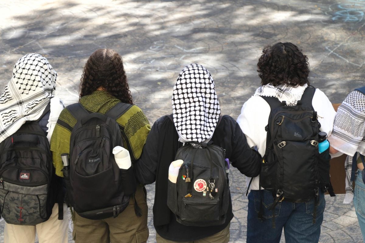 Pro-Palestinian protesters picketed in front of The Rock on Monday.