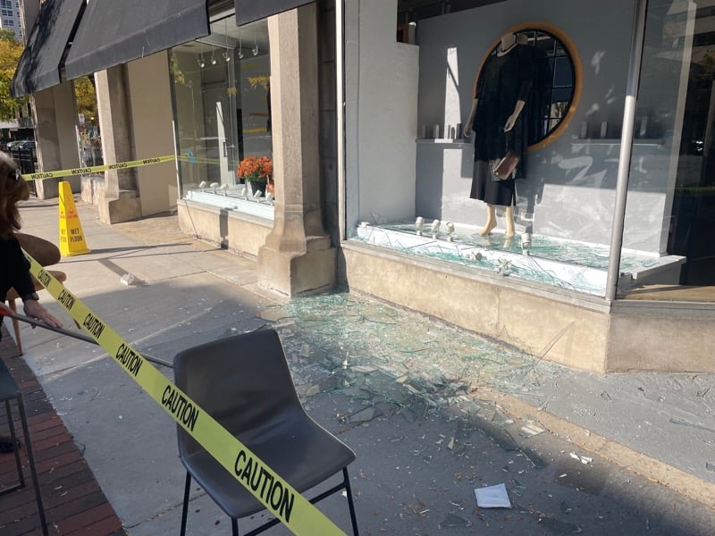 The window of Accents Plus, a women’s clothing store, shattered after two people fell into it. 

