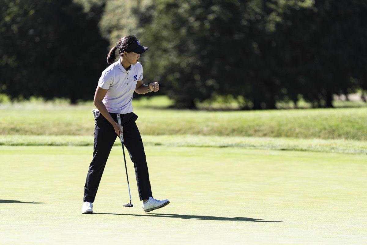 Freshman Hsin Tai Lin celebrates after making a putt at the Windy City Collegiate Classic. 