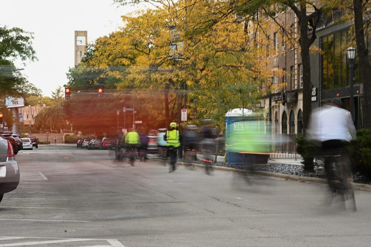 Cyclists with Evanston Rides pedal their way out of Fountain Square in downtown Evanston on Tuesday.