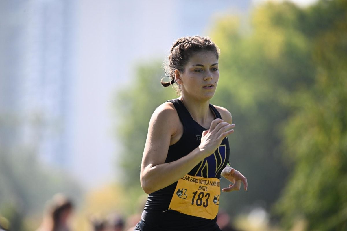 Ava Earl runs in the Loyola Lakefront Invitational earlier this season.