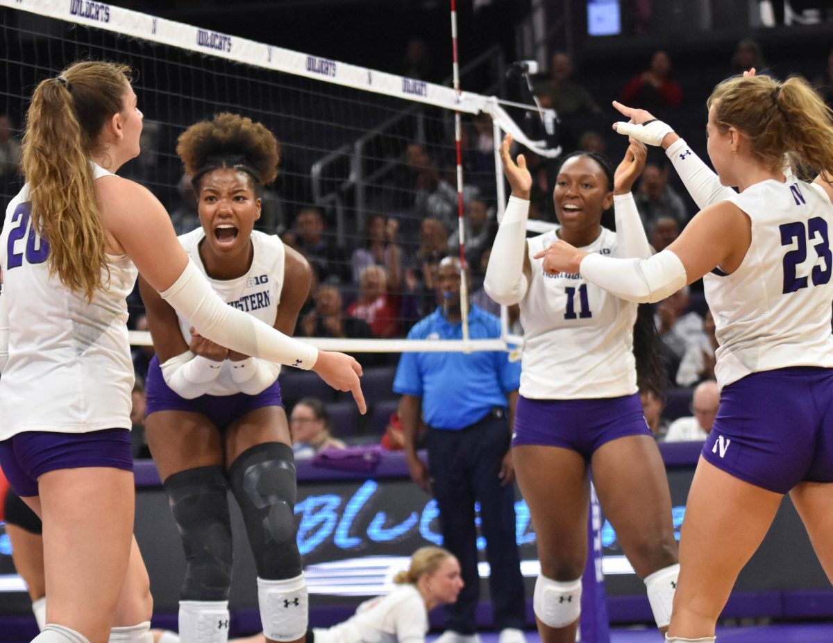 Middle blocker Kennedy Hill celebrates after winning a point. Hill recorded eight kills and seven blocks Thursday. 