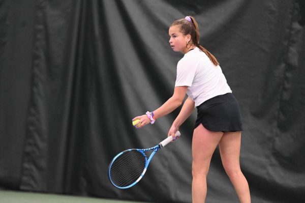 Senior Kiley Rabjohns prepares to serve in a match last season. Rabjohns went 3-0 in singles this weekend.