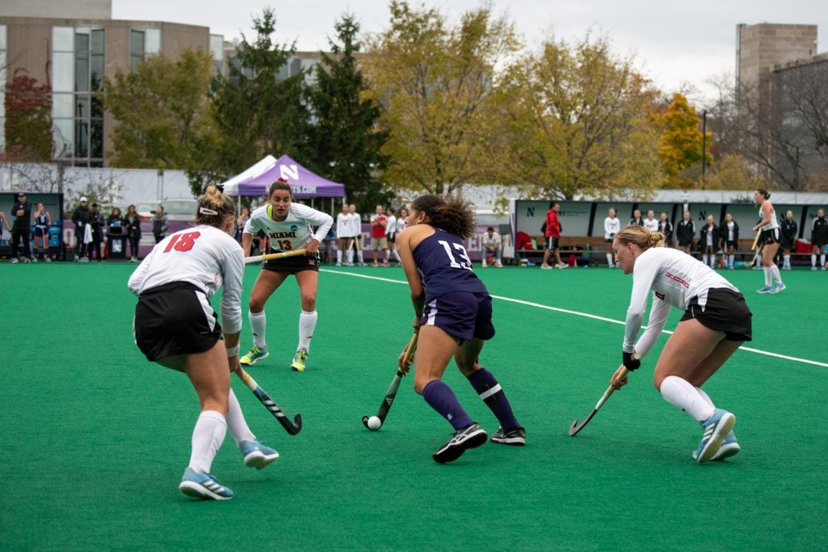 One Northwestern player with possession is surrounded by three opponents