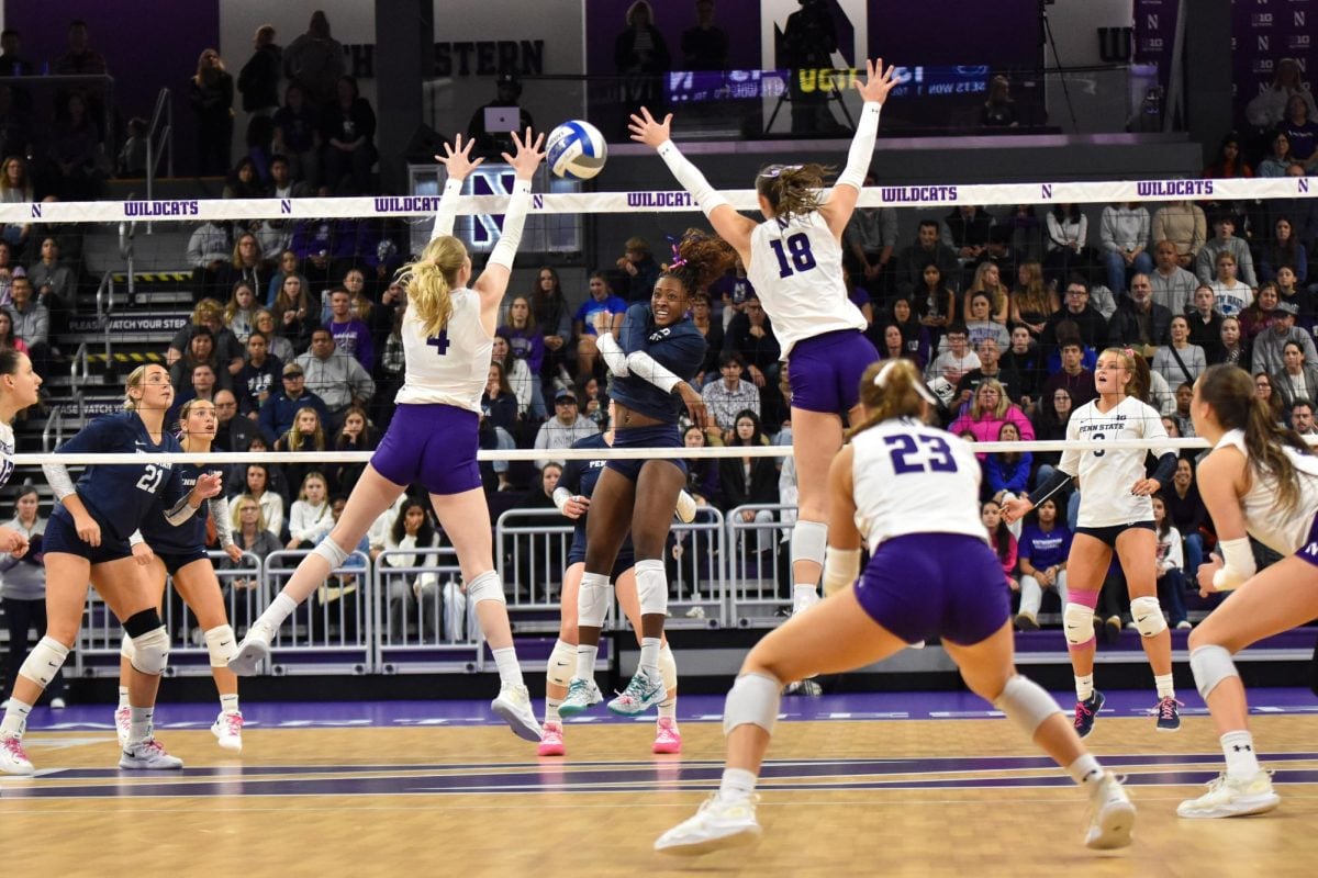 Graduate student middle blocker Sara Griffith and Randorf jump up to block a spike by Penn State.