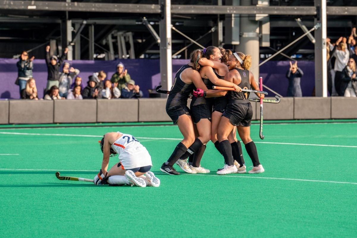 Northwestern celebrates graduate student Lauren Wadas' game-winning goal against Virginia Sunday.