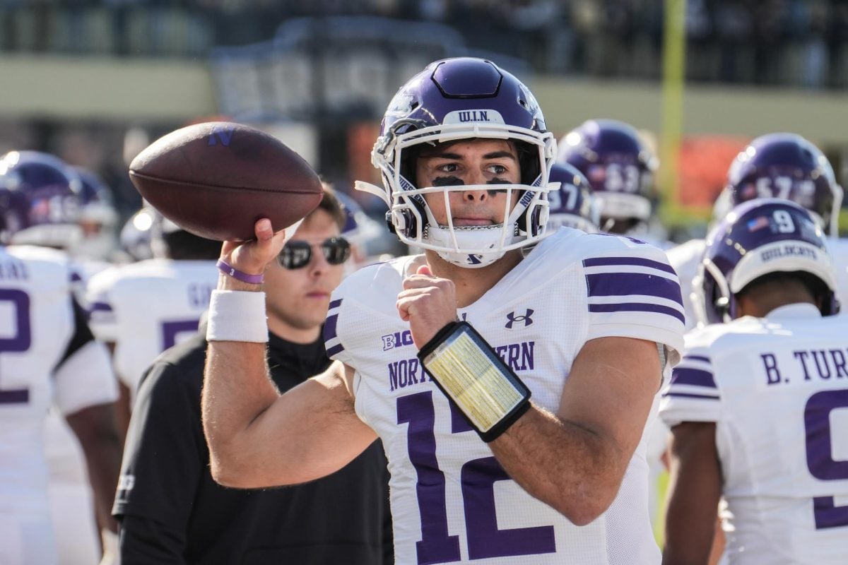 Redshirt sophomore quarterback Jack Lausch throws on the sideline at Purdue on Nov. 2. Lausch threw for 250 yards in his last outing against the Boilermakers.