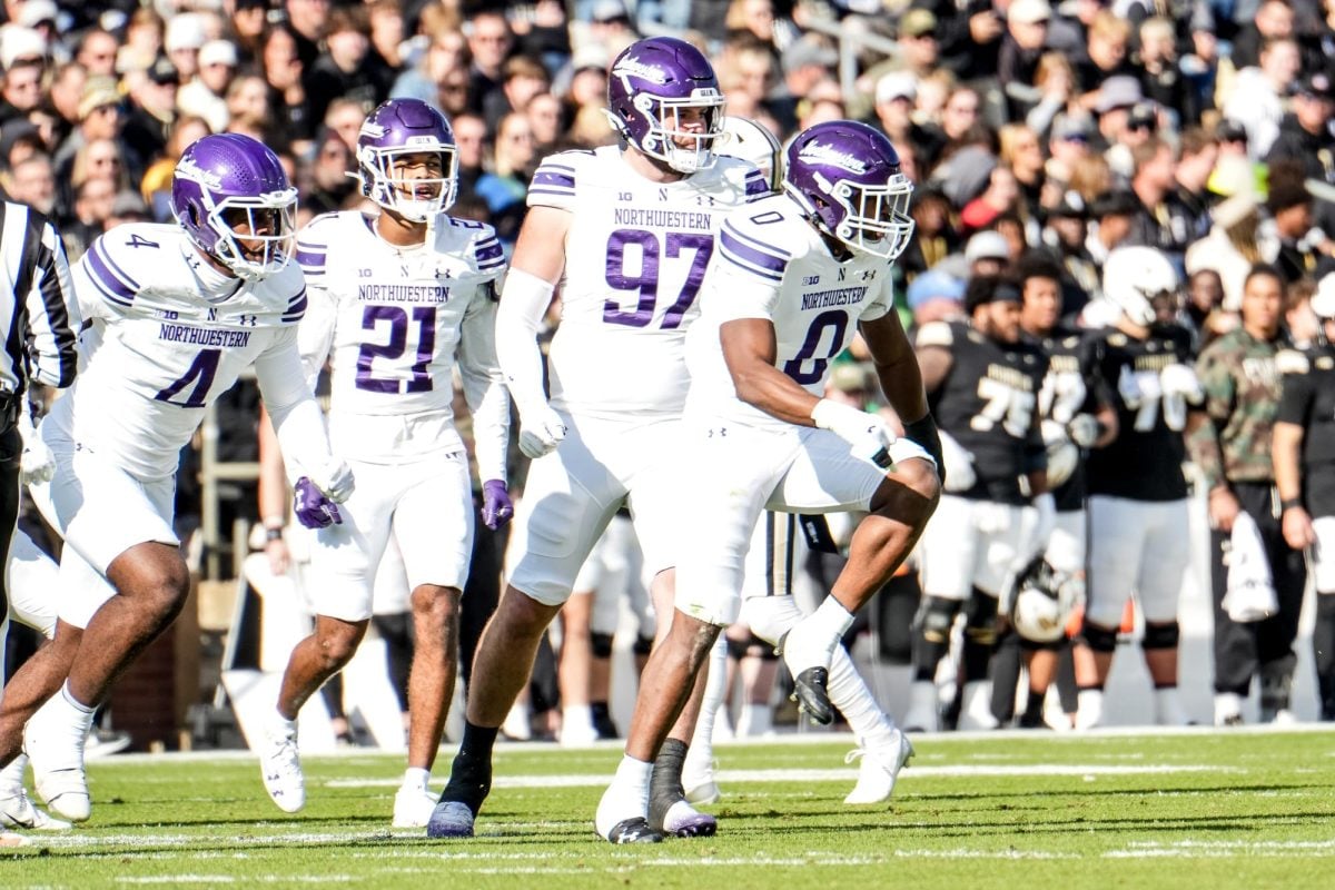 Graduate student safety Coco Azema celebrates a stop against Purdue on Nov. 2. Azema called Harlon Barnett a players' coach on Tuesday.