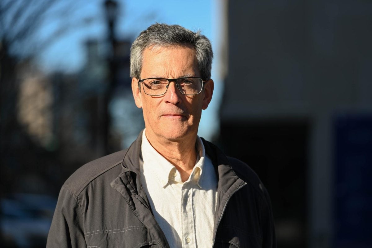 Jeff Boarini poses for a portrait in Fountain Square. The longtime Evanston resident has challenged Mayor Daniel Biss in the April election.