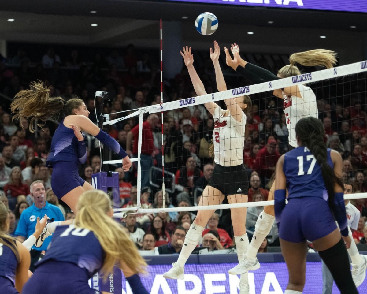 Sophomore outside hitter Lily Wagner spikes the ball over the net against No. 2 Nebraska Sunday.