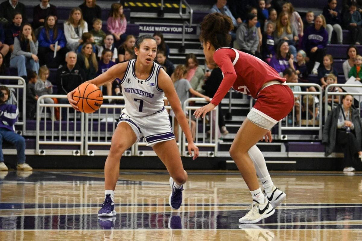 Junior guard Caroline Lau dribbles the ball Saturday against Harvard.