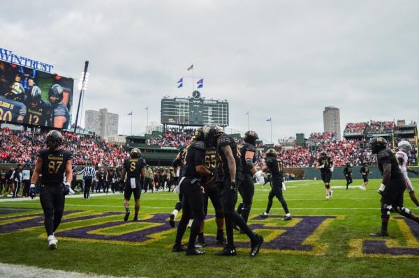 Northwestern celebrates after redshirt sophomore quarterback Jack Lausch scores the first touchdown of the game.