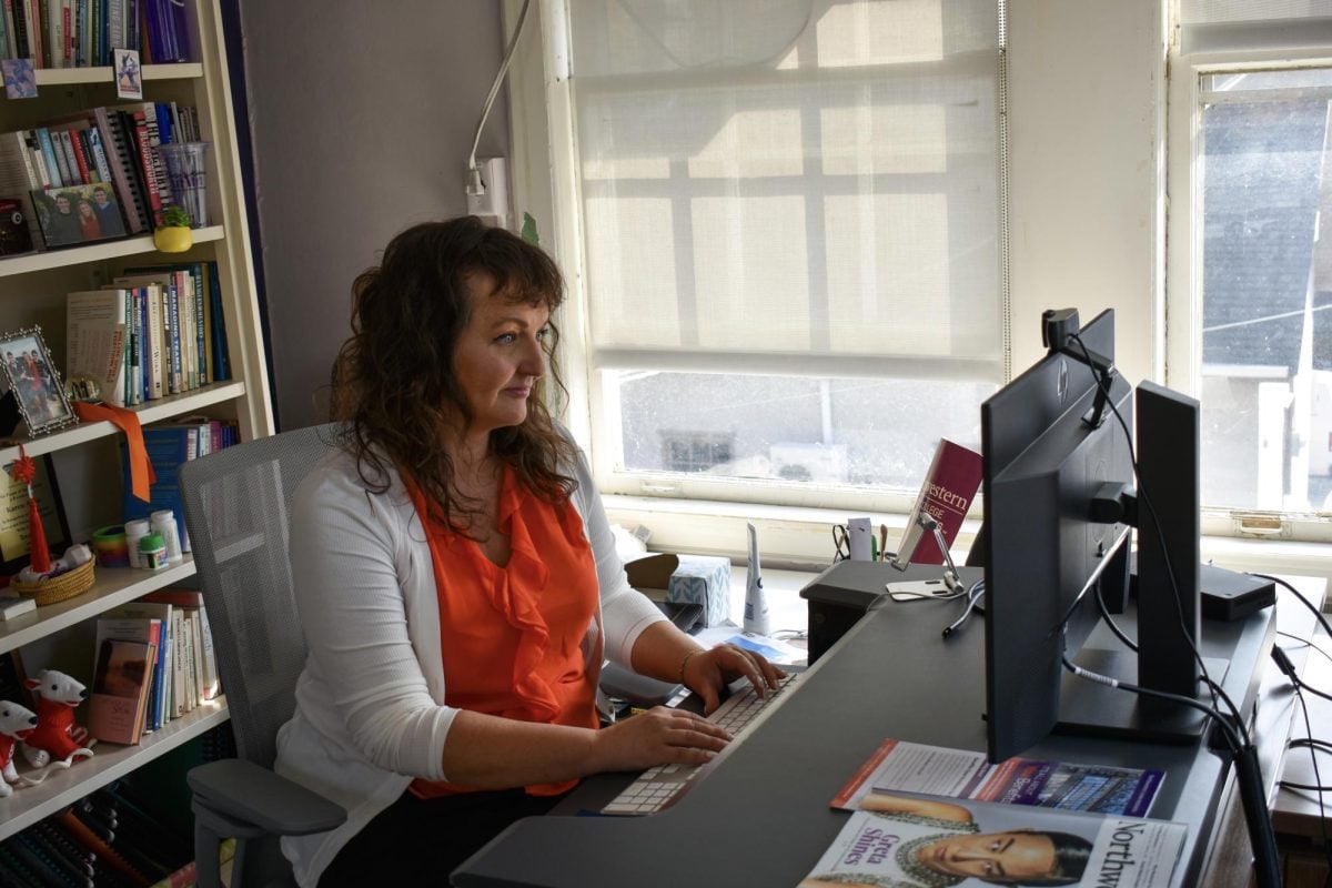 Assistant Professor of Instruction Nina Wieda sits down to work at the Chicago Field Studies office. 