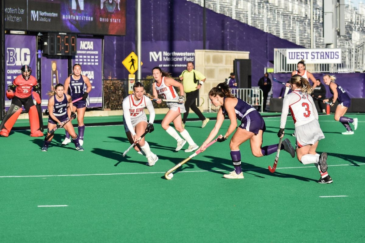 Senior midfielder Maddie Zimmer carries a ball toward the shooting circle against No. 4 Ohio State on Friday.