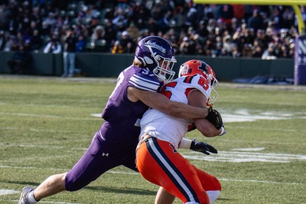 Redshirt junior linebacker Mac Uihelin wraps up a ballcarrier against No. 23 Illinois on Saturday.