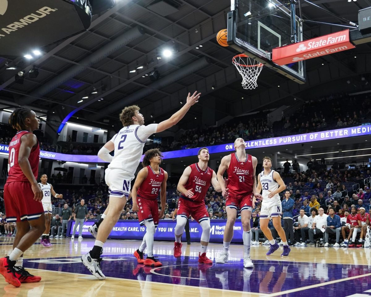 Junior forward Nick Martinelli shoots a layup.