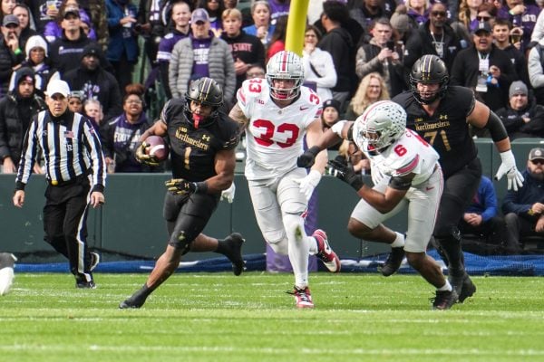 Graduate student running back Cam Porter rushes against No. 2 Ohio State on Saturday. Porter tallied 37 yards on 10 carries during the defeat.