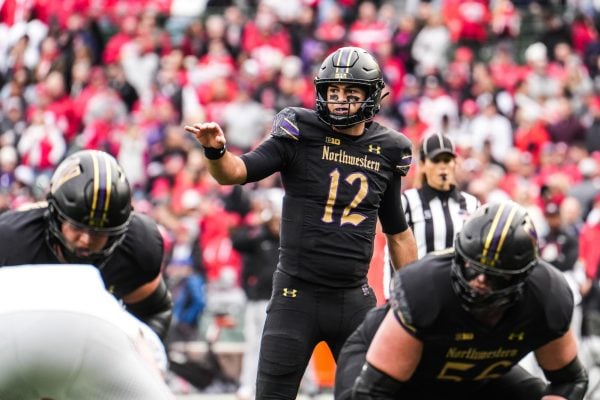 Redshirt sophomore quarterback Jack Lausch prepares to take a snap against Ohio State on Saturday.