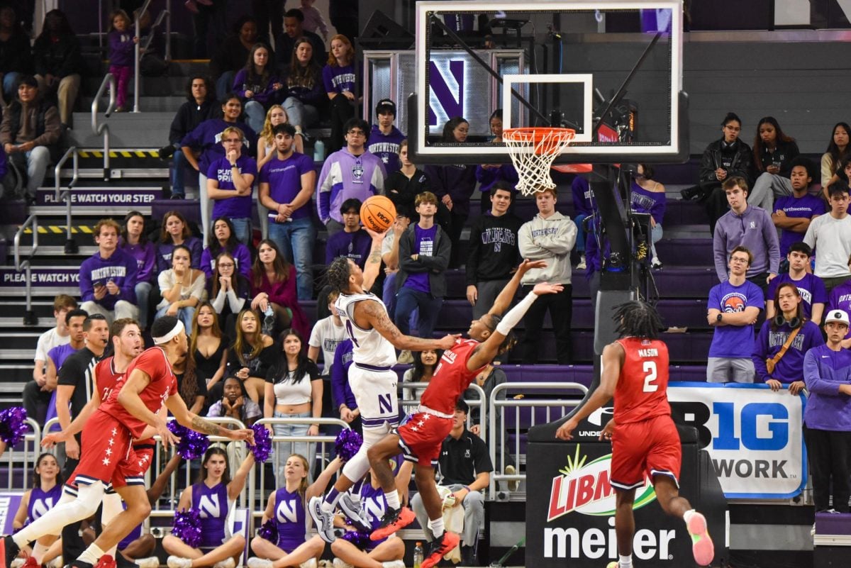 Freshman guard K.J. Windham drives toward the basket.