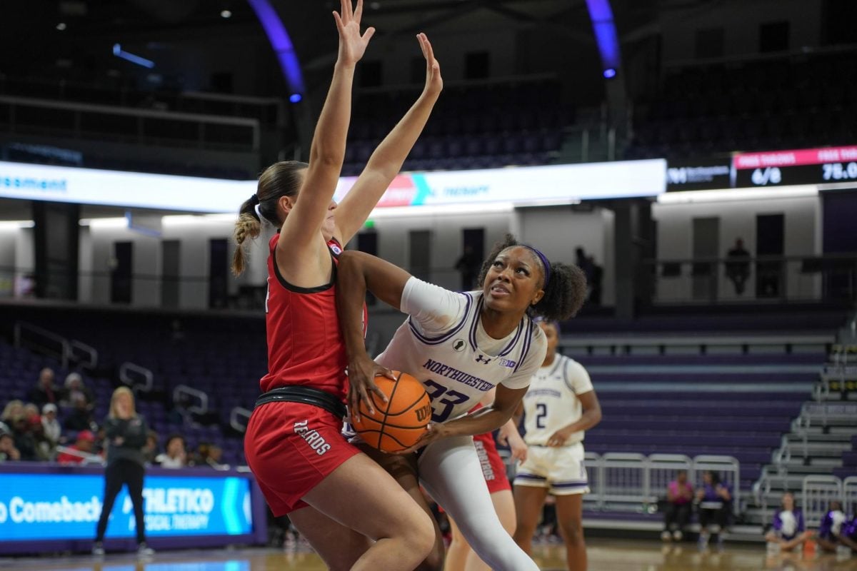 Freshman forward Tayla Thomas posts up a defender in a game earlier this season.