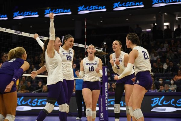 Northwestern celebrates winning a point. 