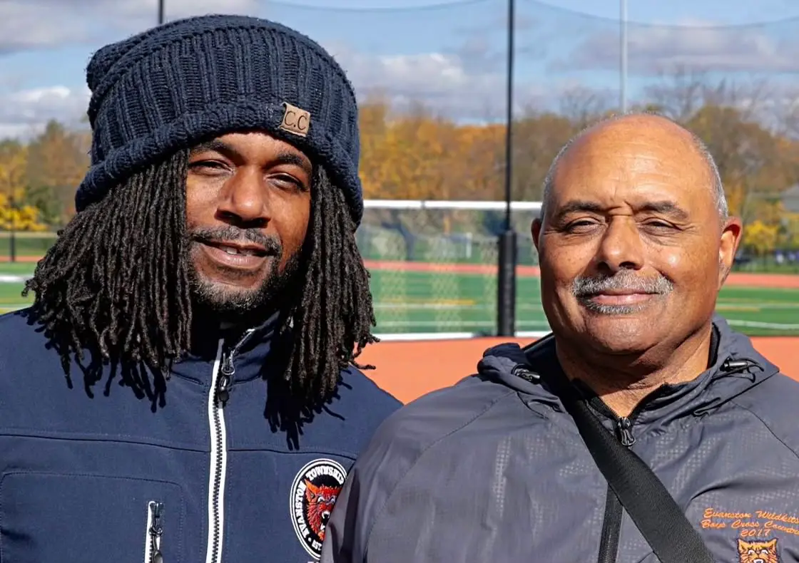 Michelin, on the right, led the boys’ cross country team from 2009 to 2017, when he passed the baton to his son, Donald Michelin Jr.
