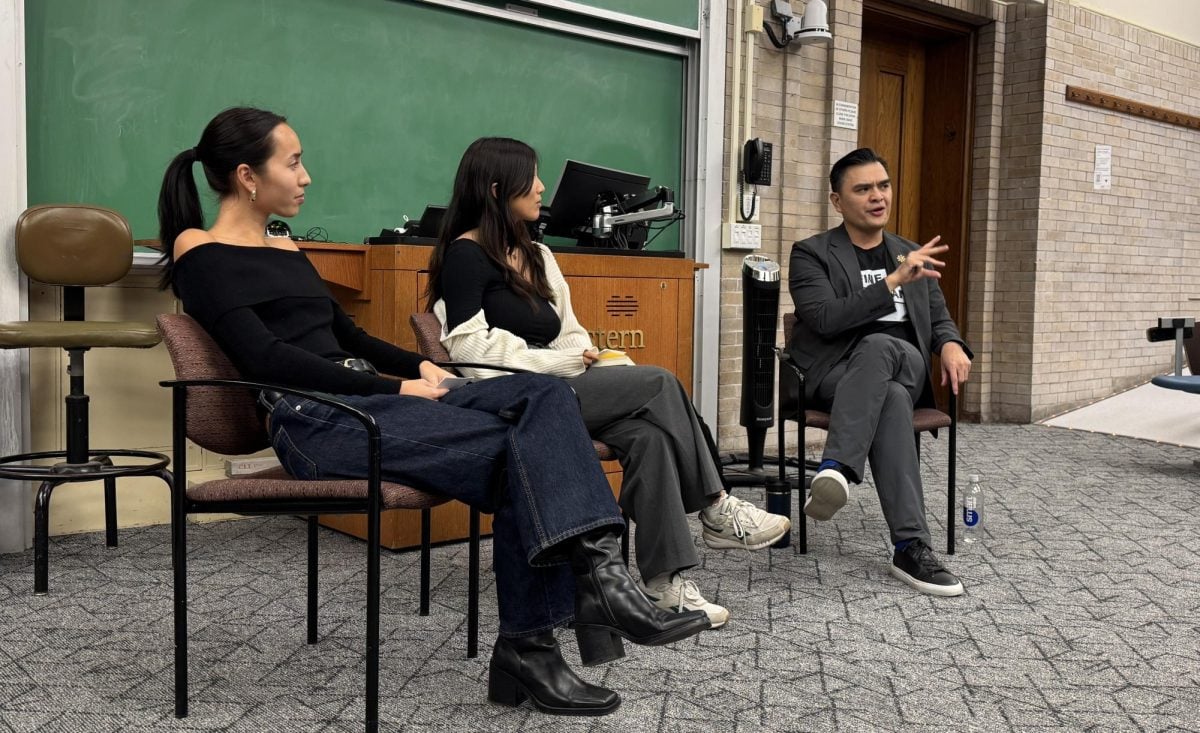 Activist Jose Antonio Vargas leans forwards in his chair to share a detailed anecdote of his life as an undocumented immigrant to a crowd of Northwestern students.