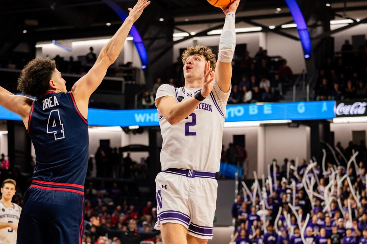 Junior forward Nick Martinelli shoots a floater against Dayton last year. Martinelli poured in a career-high 32 points Saturday.