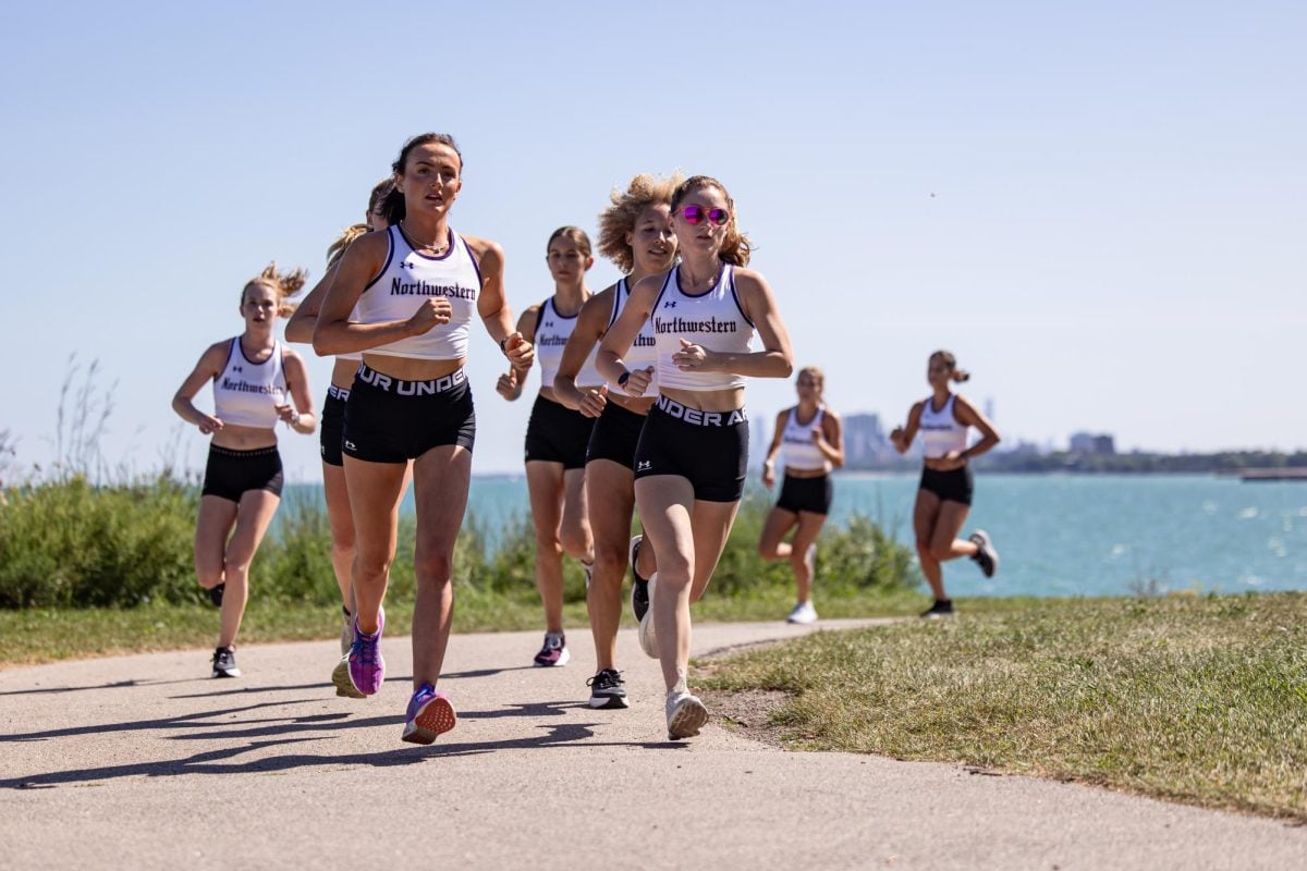 Holly Smith (left) and Chloe Wellings lead the pack during a training run this season.
