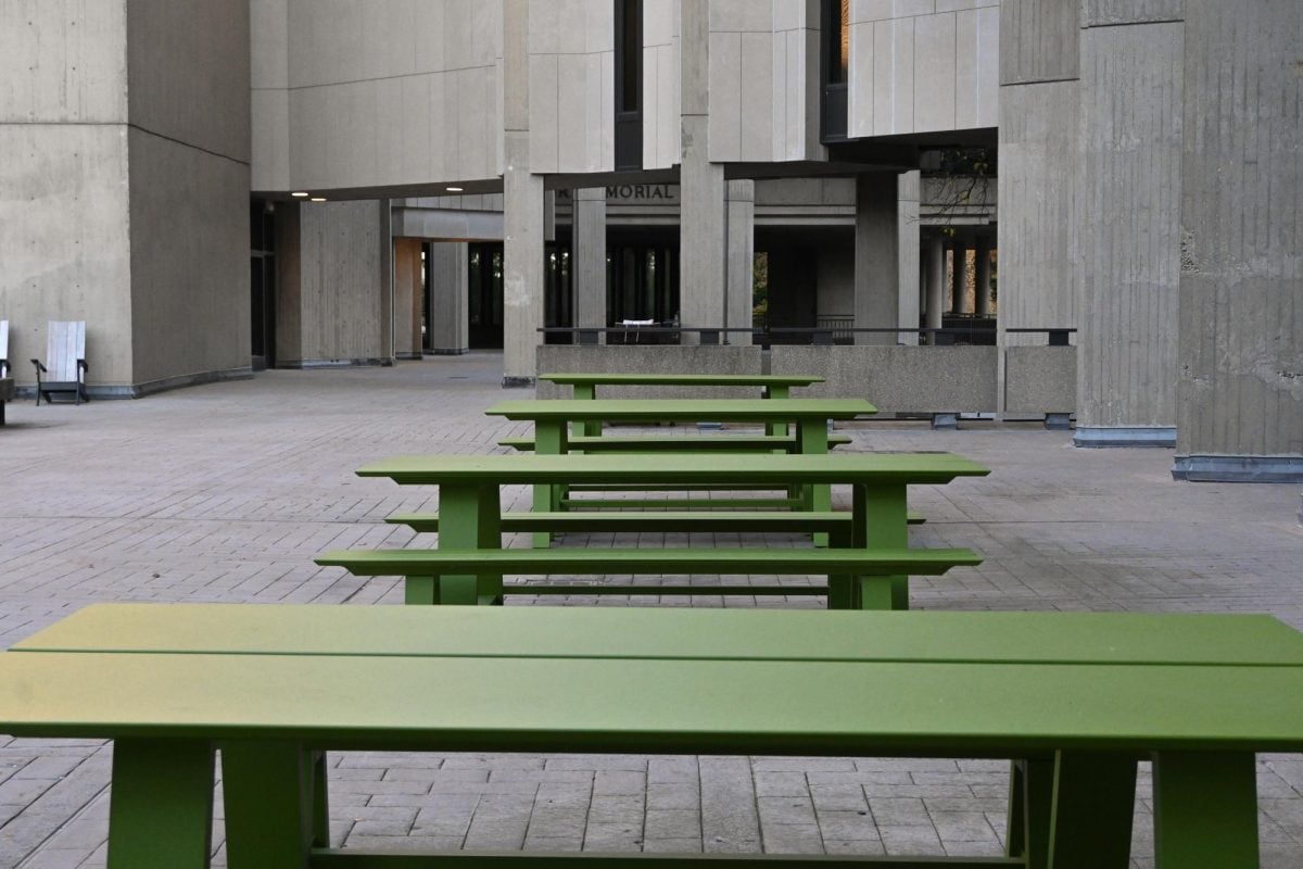 Green tables under the columns of Main Library